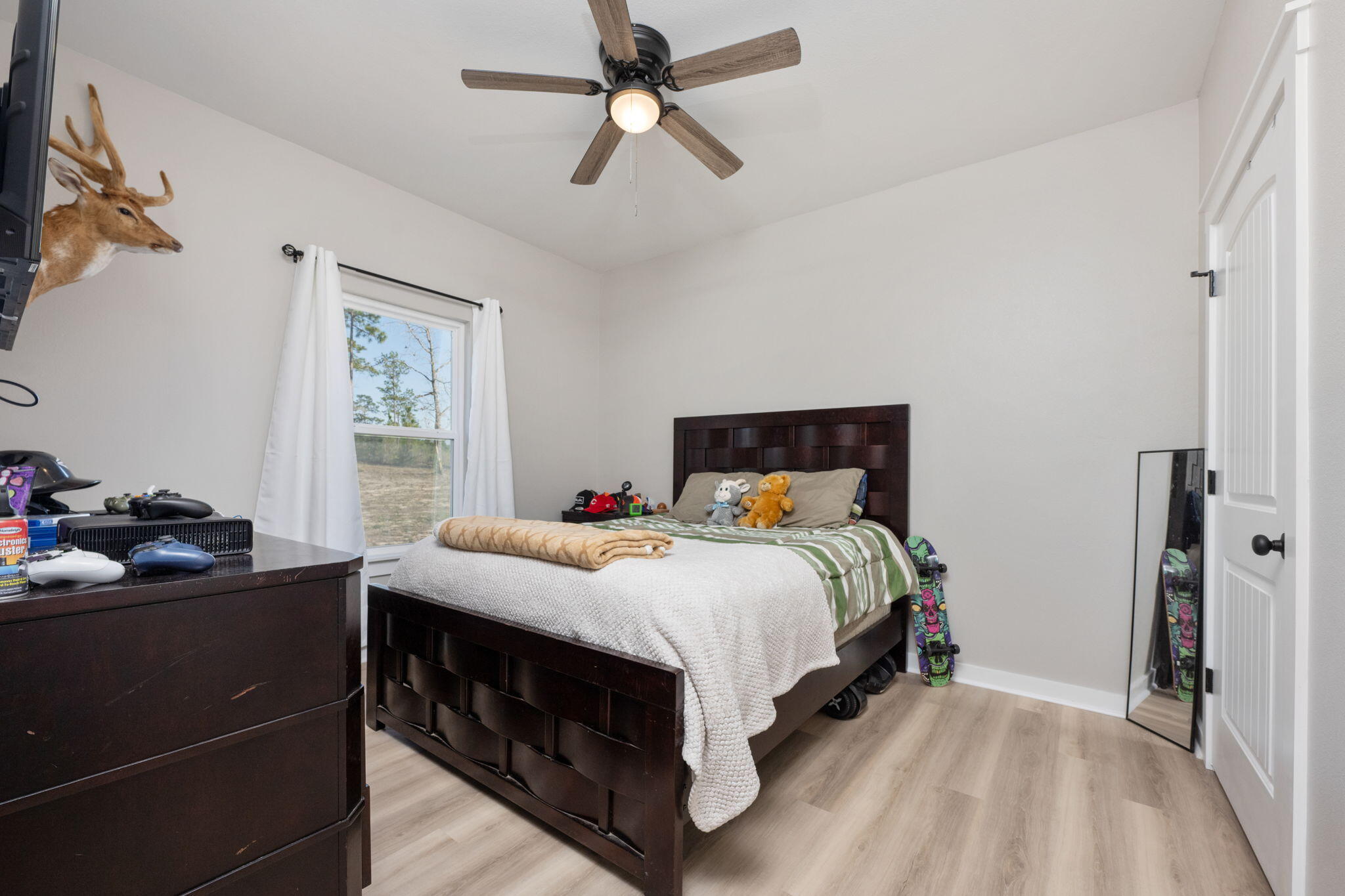 6150 Sherman Kennedy Road Baker, FL 32531 - Photo 14 of 43 a bedroom with a bed and a window