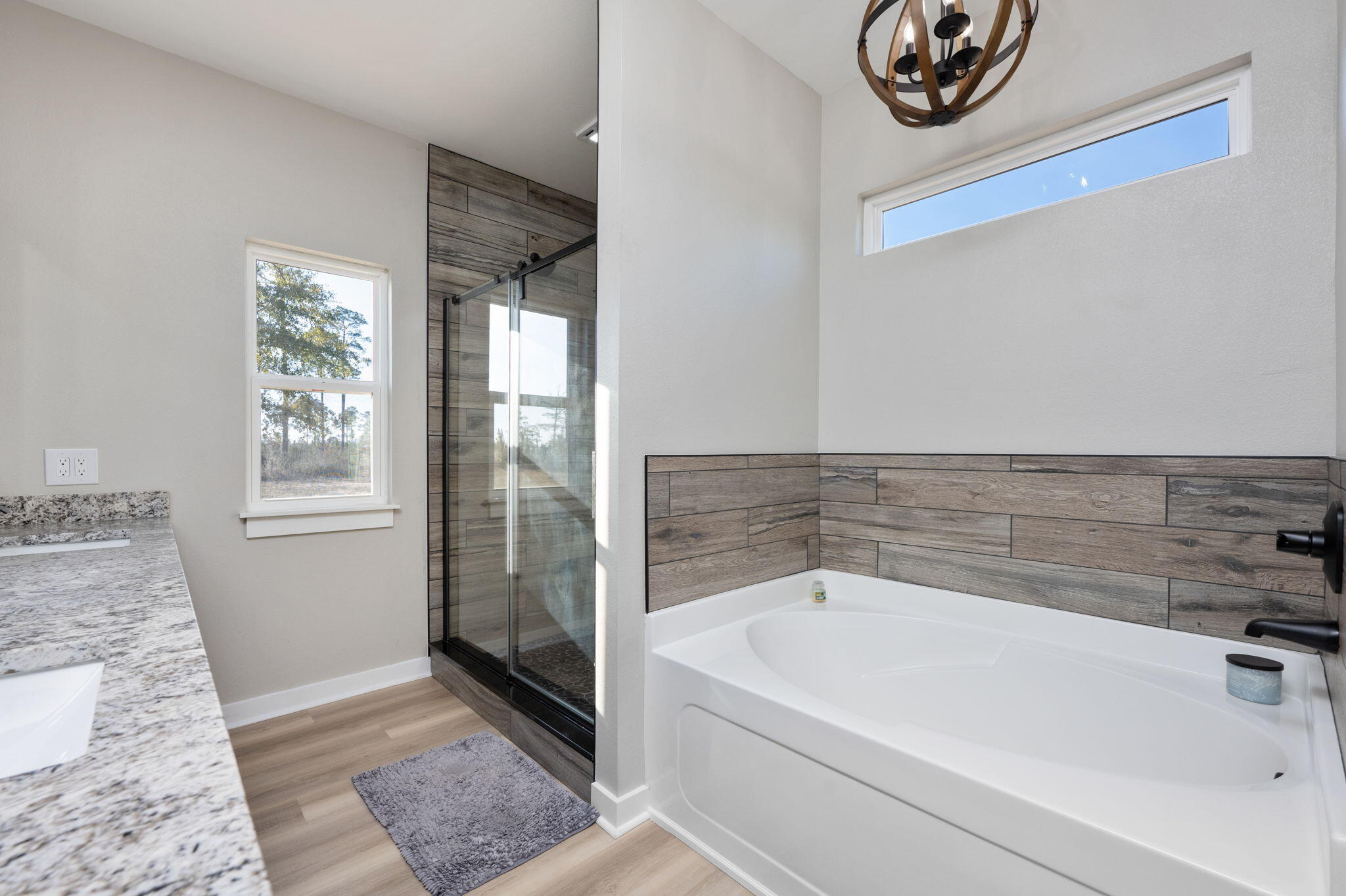 6150 Sherman Kennedy Road Baker, FL 32531 - Photo 17 of 43 a bathroom with a bathtub and shower