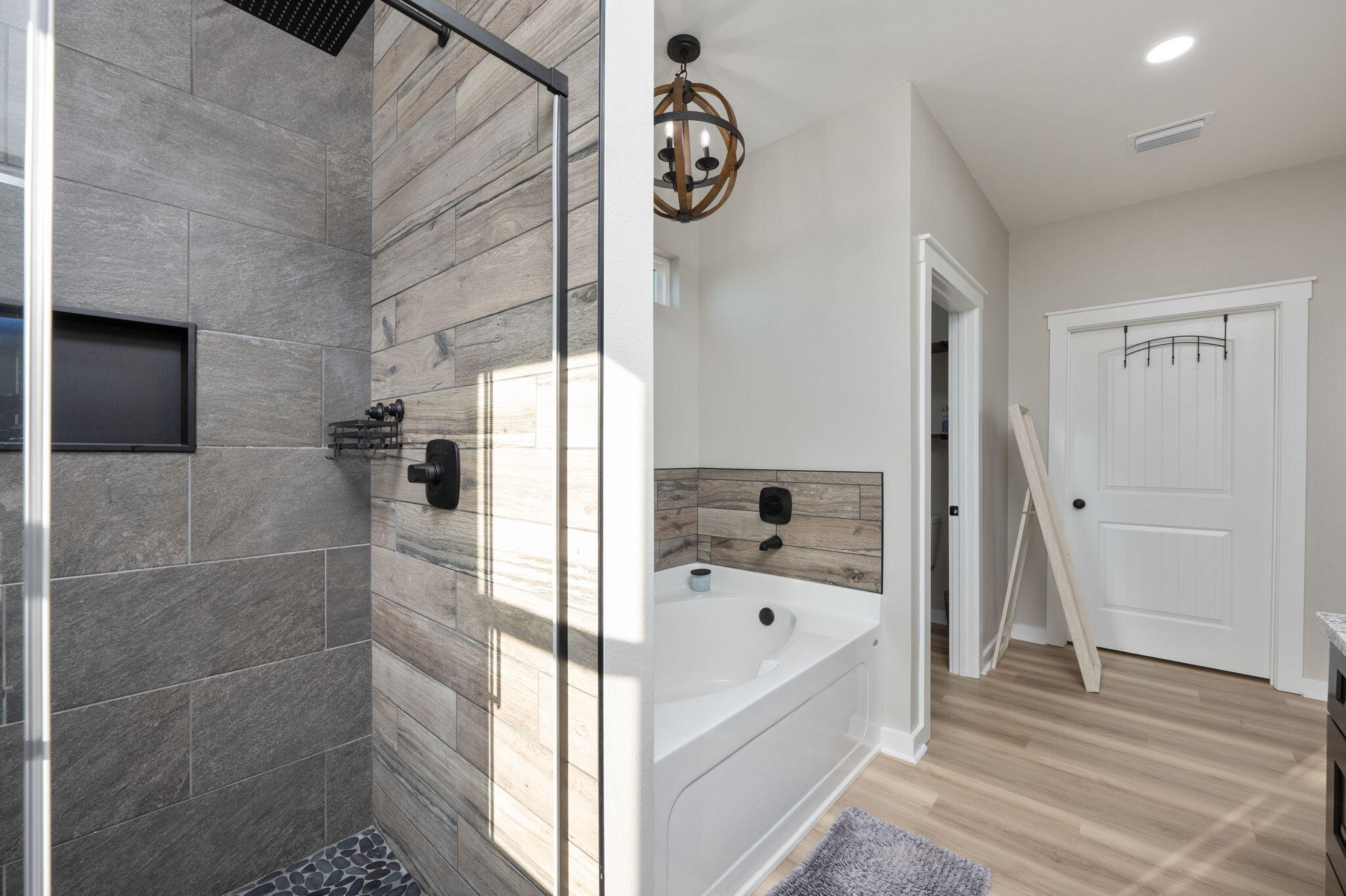 6150 Sherman Kennedy Road Baker, FL 32531 - Photo 19 of 43 a bathroom with a bathtub and a shower