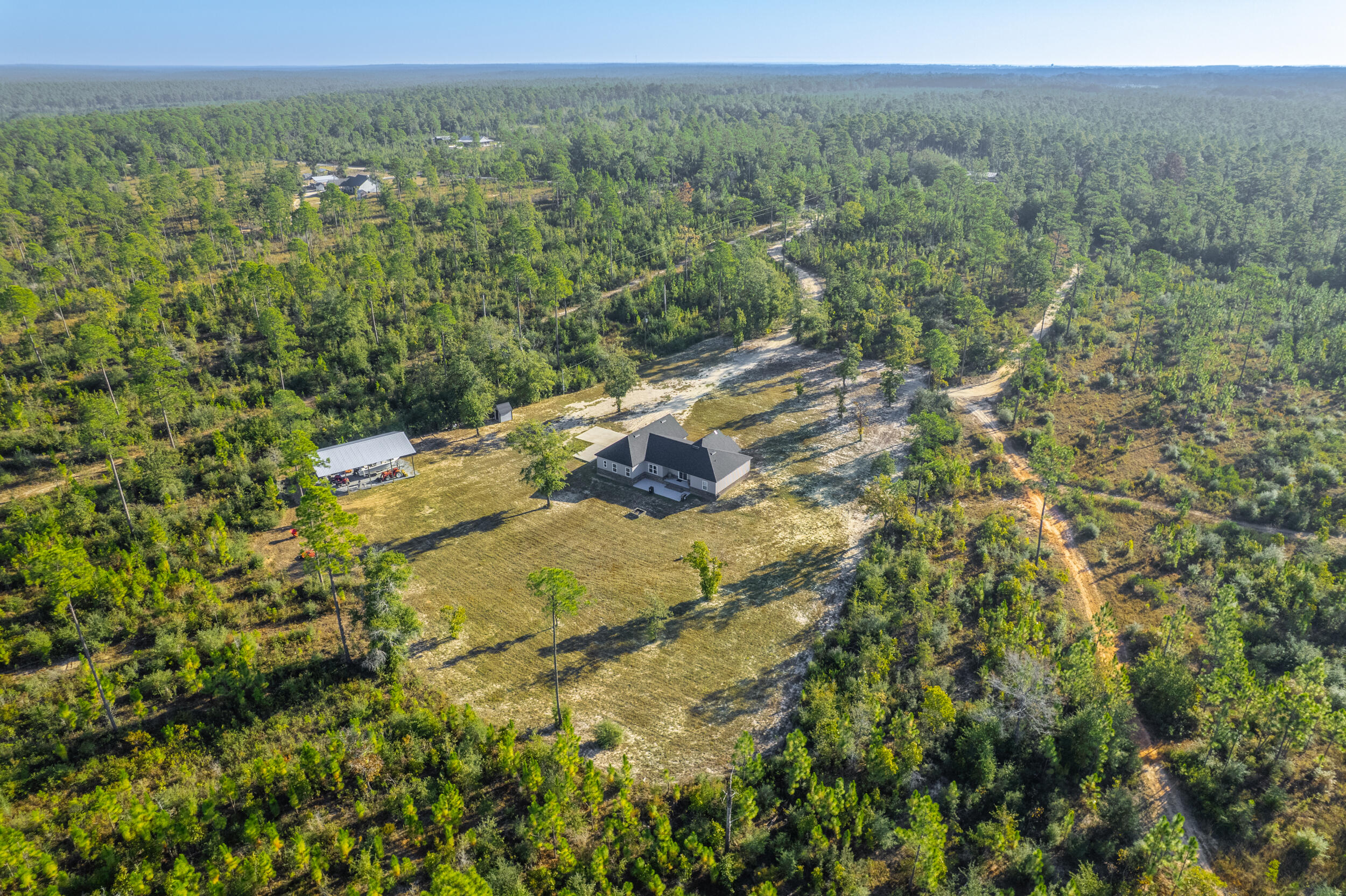 6150 Sherman Kennedy Road Baker, FL 32531 - Photo 21 of 43 a view of a yard with an outdoor space