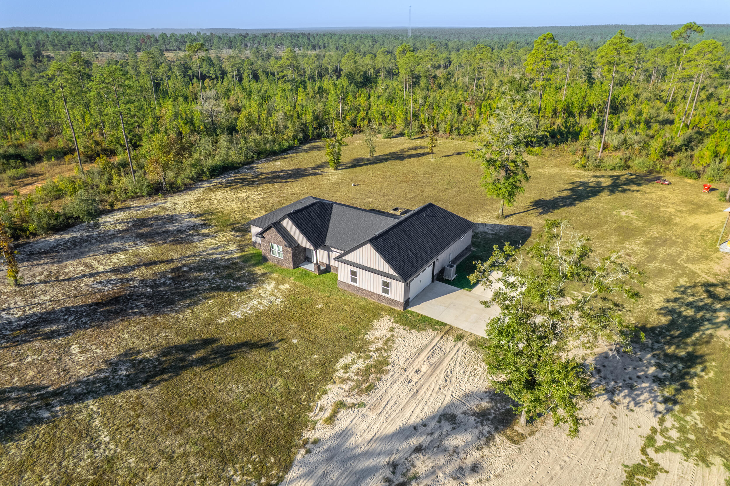 6150 Sherman Kennedy Road Baker, FL 32531 - Photo 24 of 43 a view of a yard with an outdoor space
