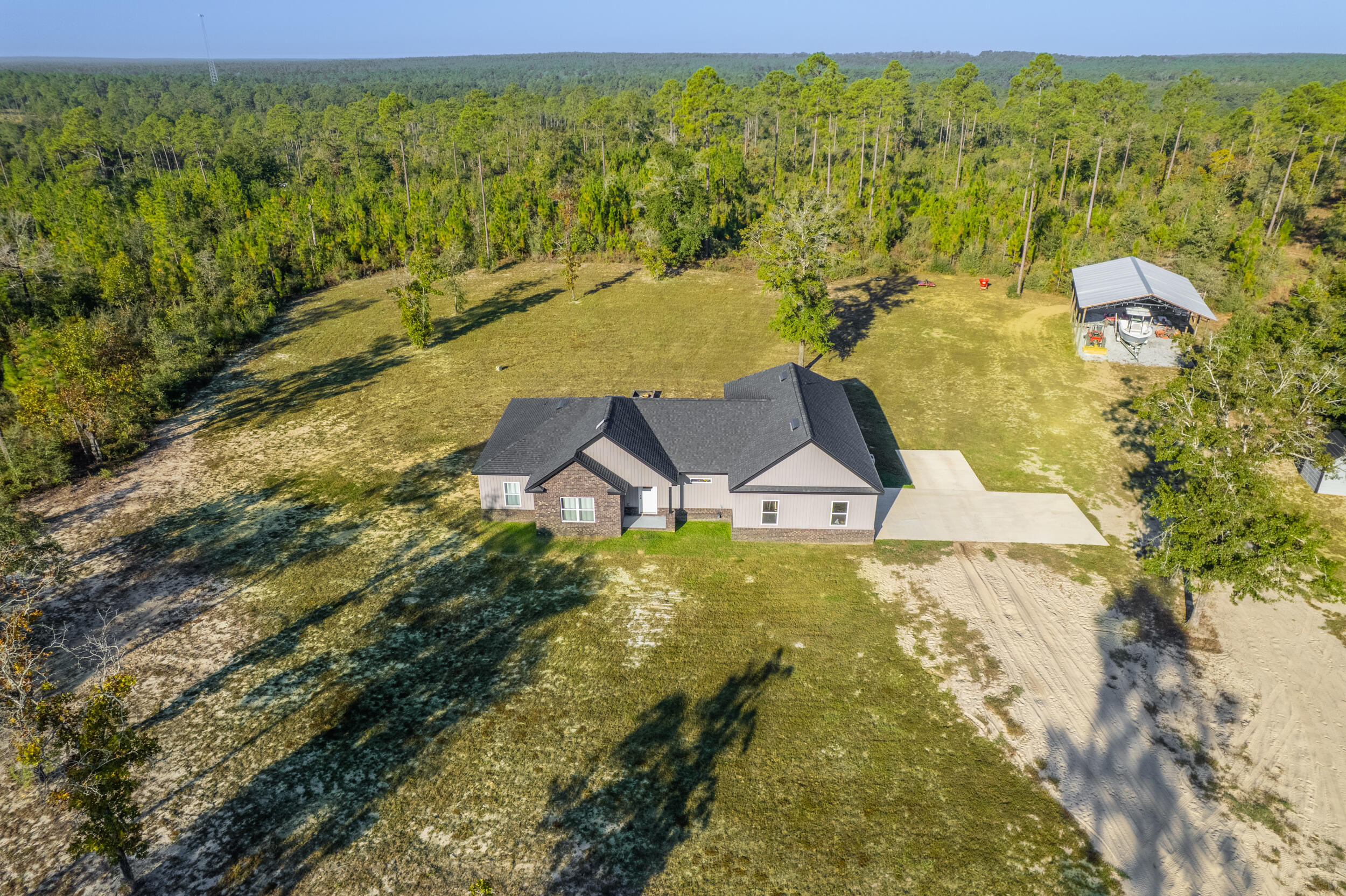 6150 Sherman Kennedy Road Baker, FL 32531 - Photo 25 of 43 a view of a pool with a yard