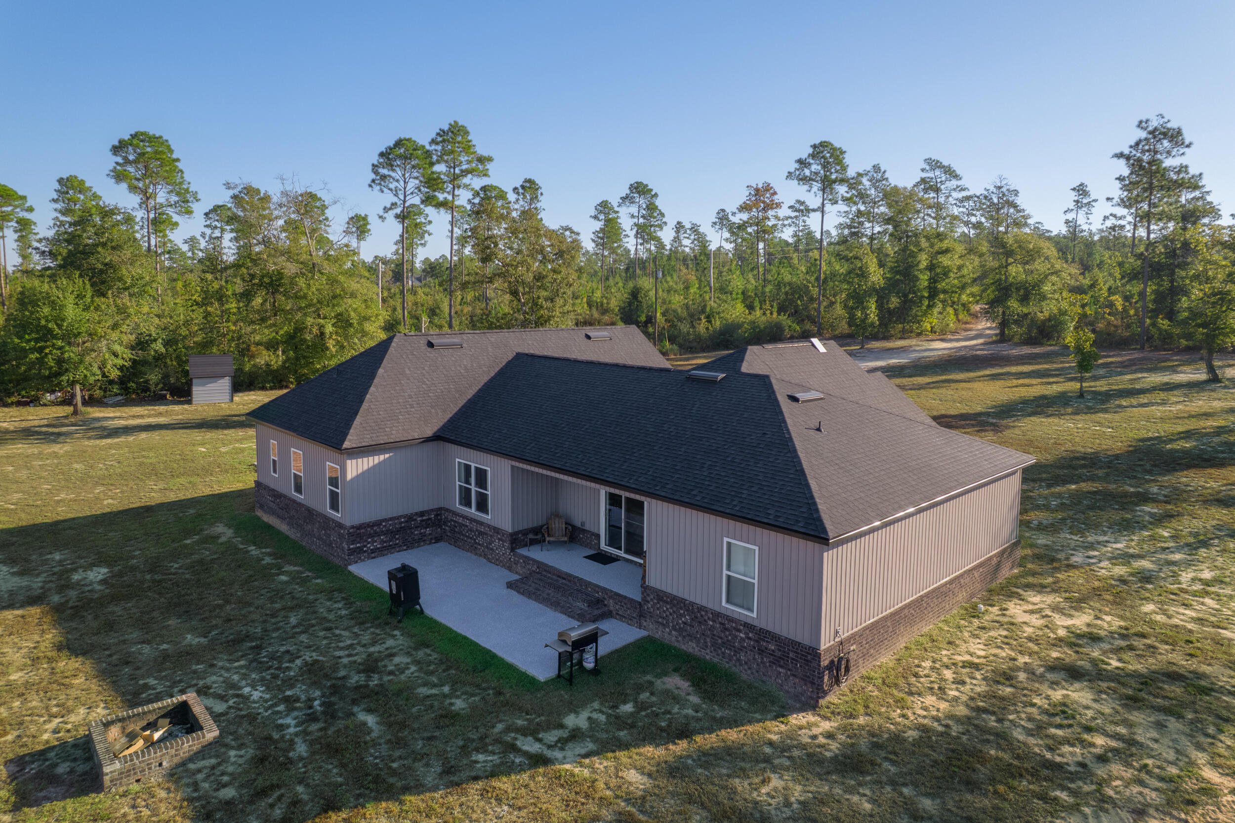 6150 Sherman Kennedy Road Baker, FL 32531 - Photo 3 of 43 a aerial view of a house with a yard