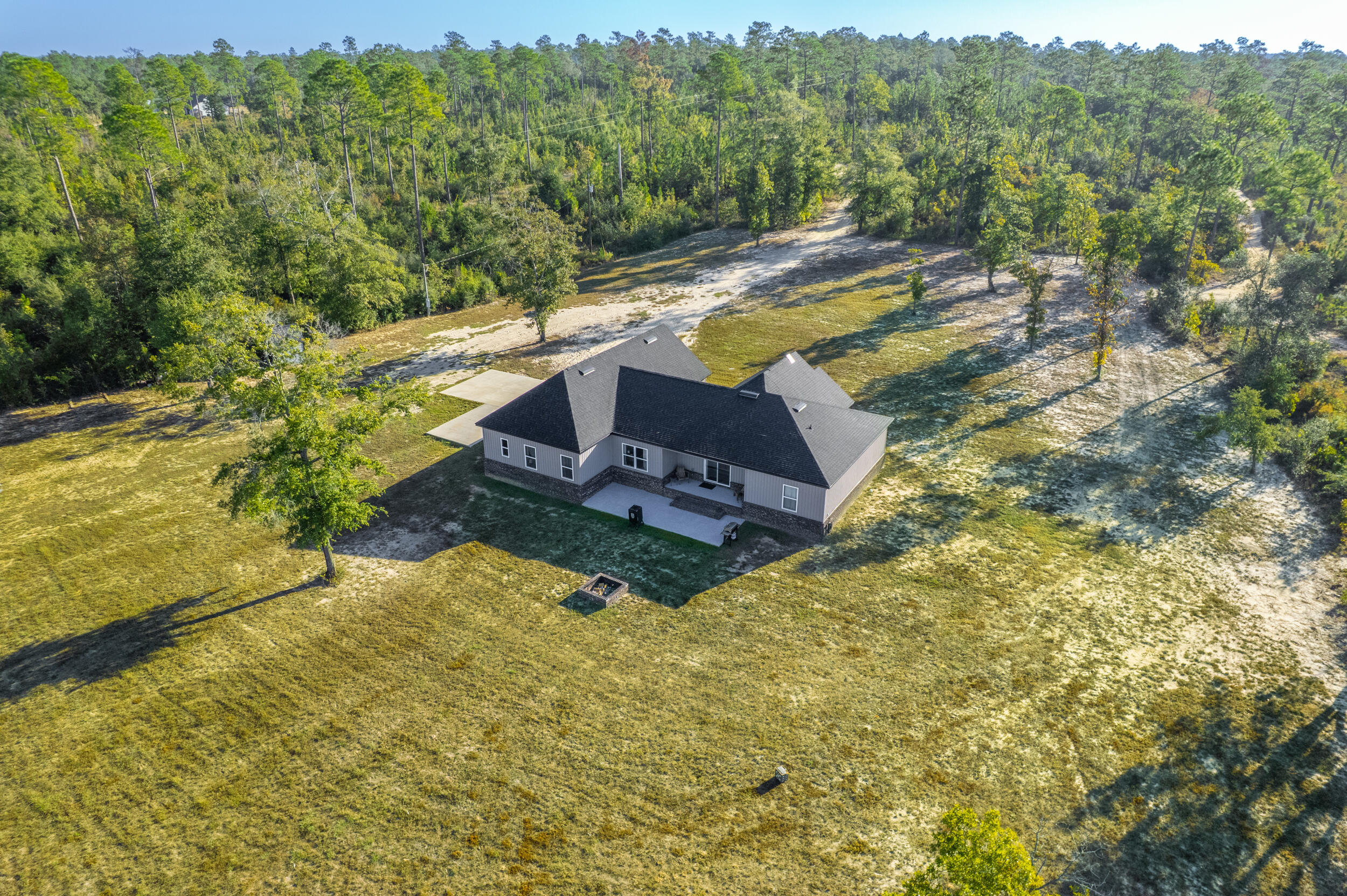 6150 Sherman Kennedy Road Baker, FL 32531 - Photo 37 of 43 a view of a yard with swimming pool