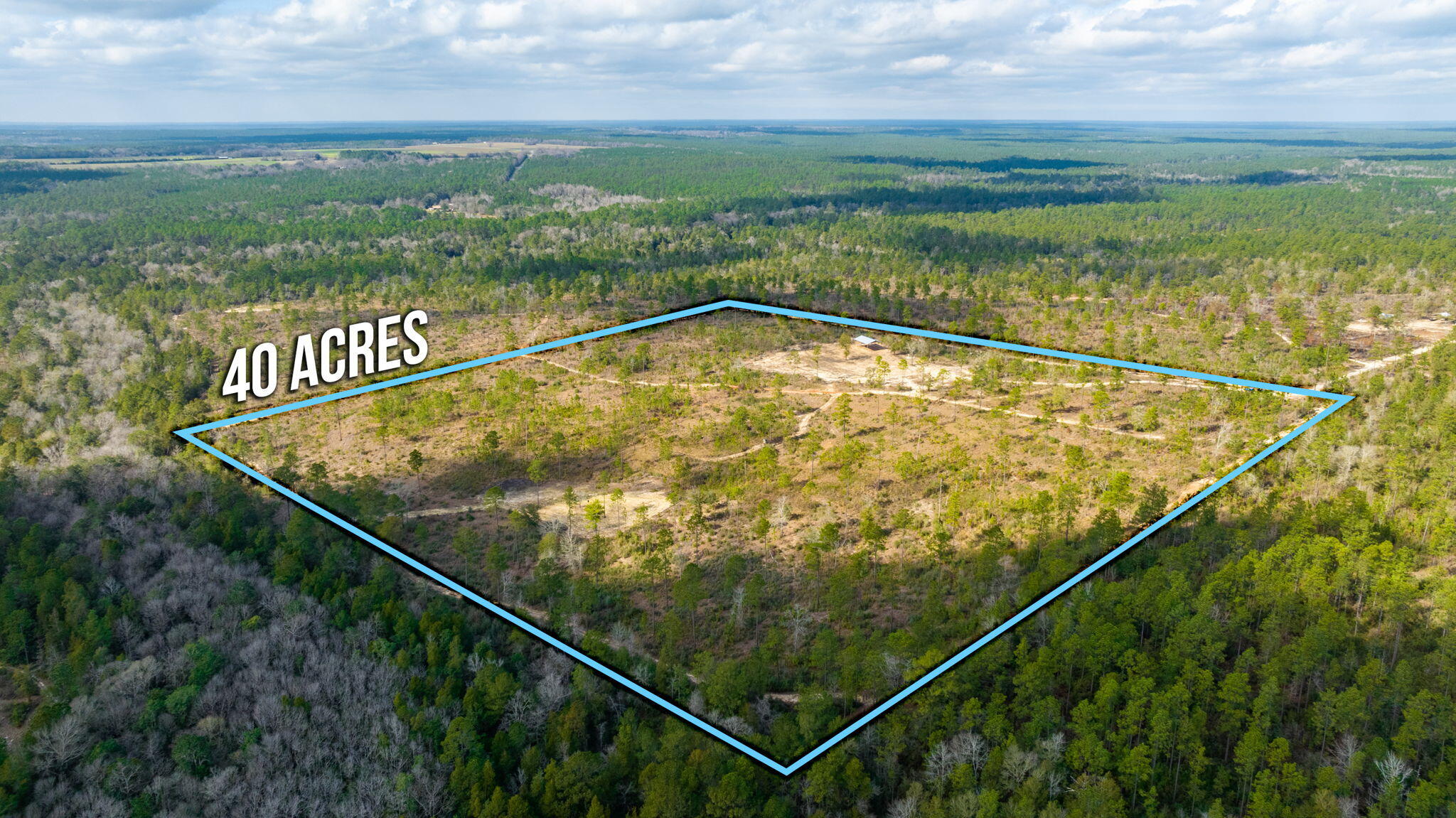 6150 Sherman Kennedy Road Baker, FL 32531 - Photo 39 of 43 a view of a tennis court