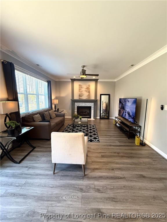 171 Apache Trail Sanford, NC 27332 - Photo 11 of 37 a living room with furniture a fireplace and a flat screen tv