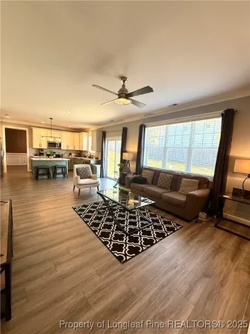 a living room with furniture windows and a fireplace