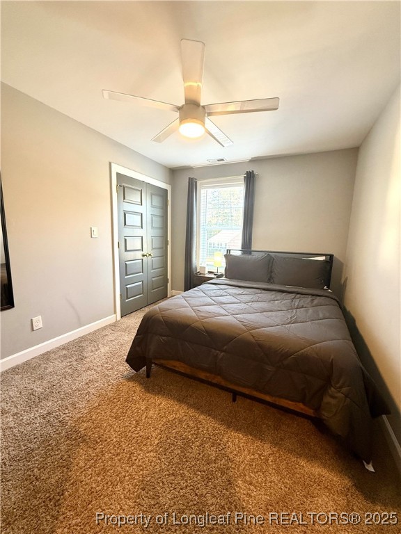 171 Apache Trail Sanford, NC 27332 - Photo 17 of 37 a bedroom with a bed and a chandelier