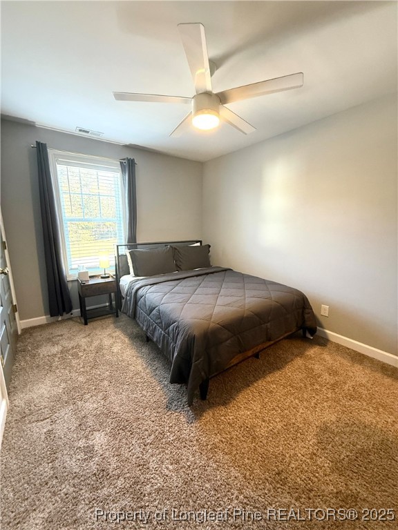 171 Apache Trail Sanford, NC 27332 - Photo 19 of 37 a bedroom with a bed and window