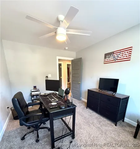 a view of a workspace with furniture