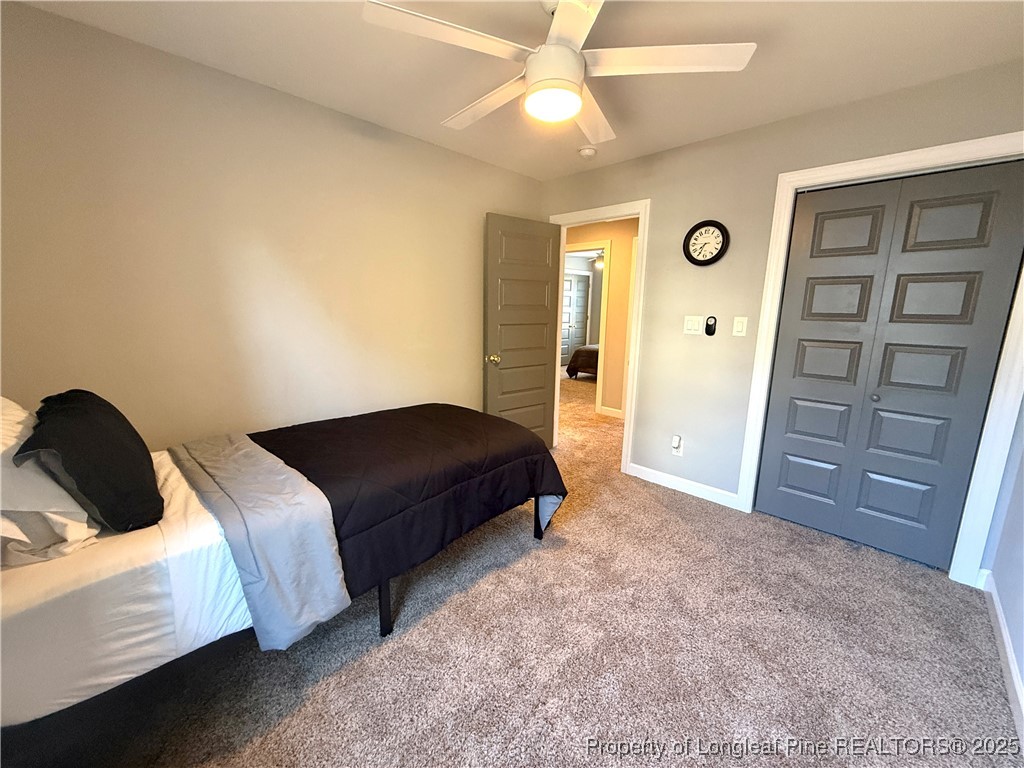 171 Apache Trail Sanford, NC 27332 - Photo 22 of 37 a bedroom with a bed and a closet