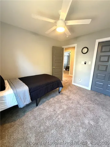 a spacious bedroom with a bed and a cabinets