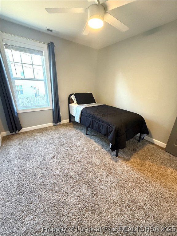 171 Apache Trail Sanford, NC 27332 - Photo 24 of 37 a room with a bed and a large window