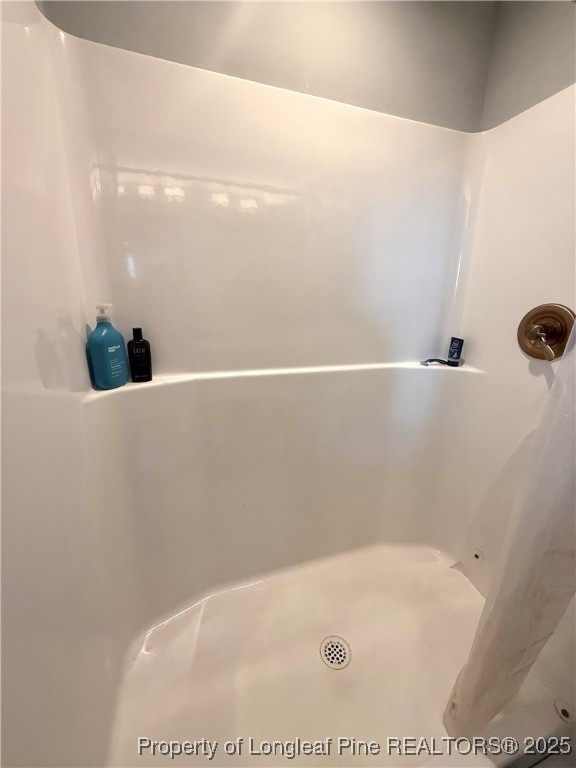 171 Apache Trail Sanford, NC 27332 - Photo 26 of 37 a bathroom with a tub