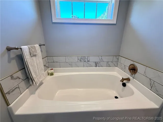 a bathroom with a bathtub