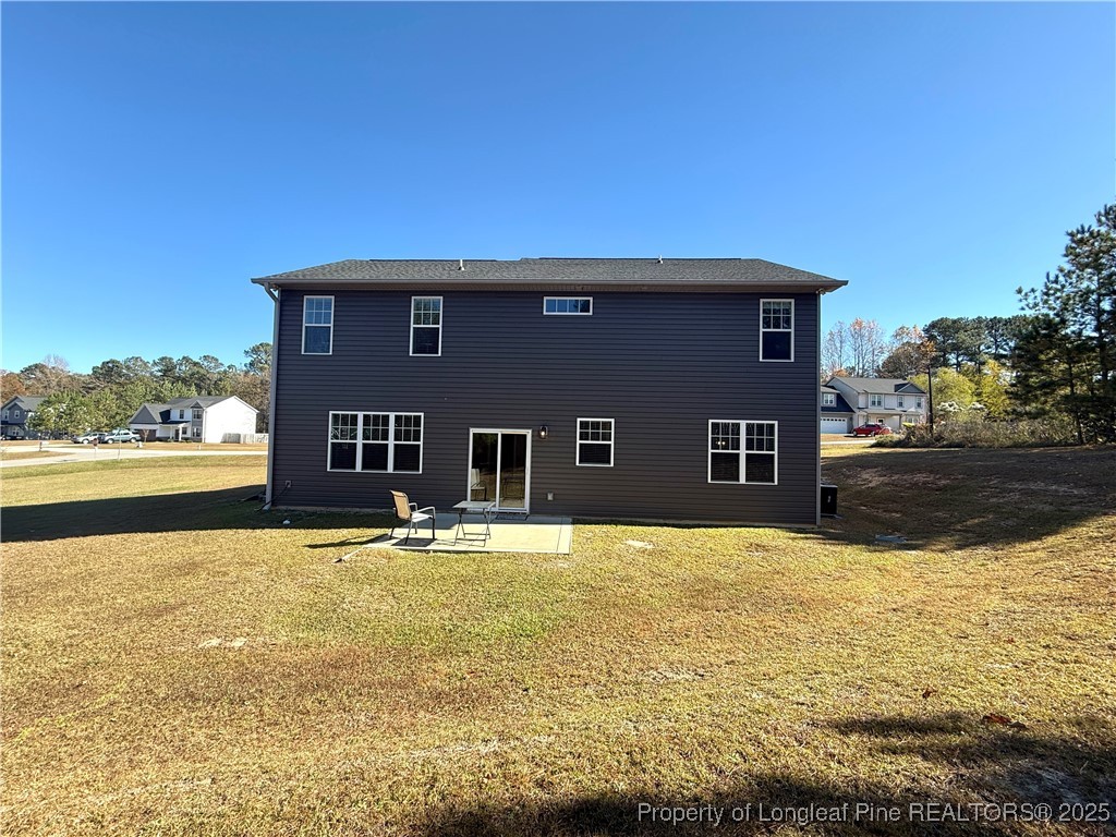 171 Apache Trail Sanford, NC 27332 - Photo 36 of 37 a house view with swimming pool and a yard
