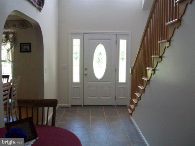 31430 Chesterville Bridge Road Millington, MD 21651 - Photo 2 of 14 foyer w/ two-story open ceiling to open balcony