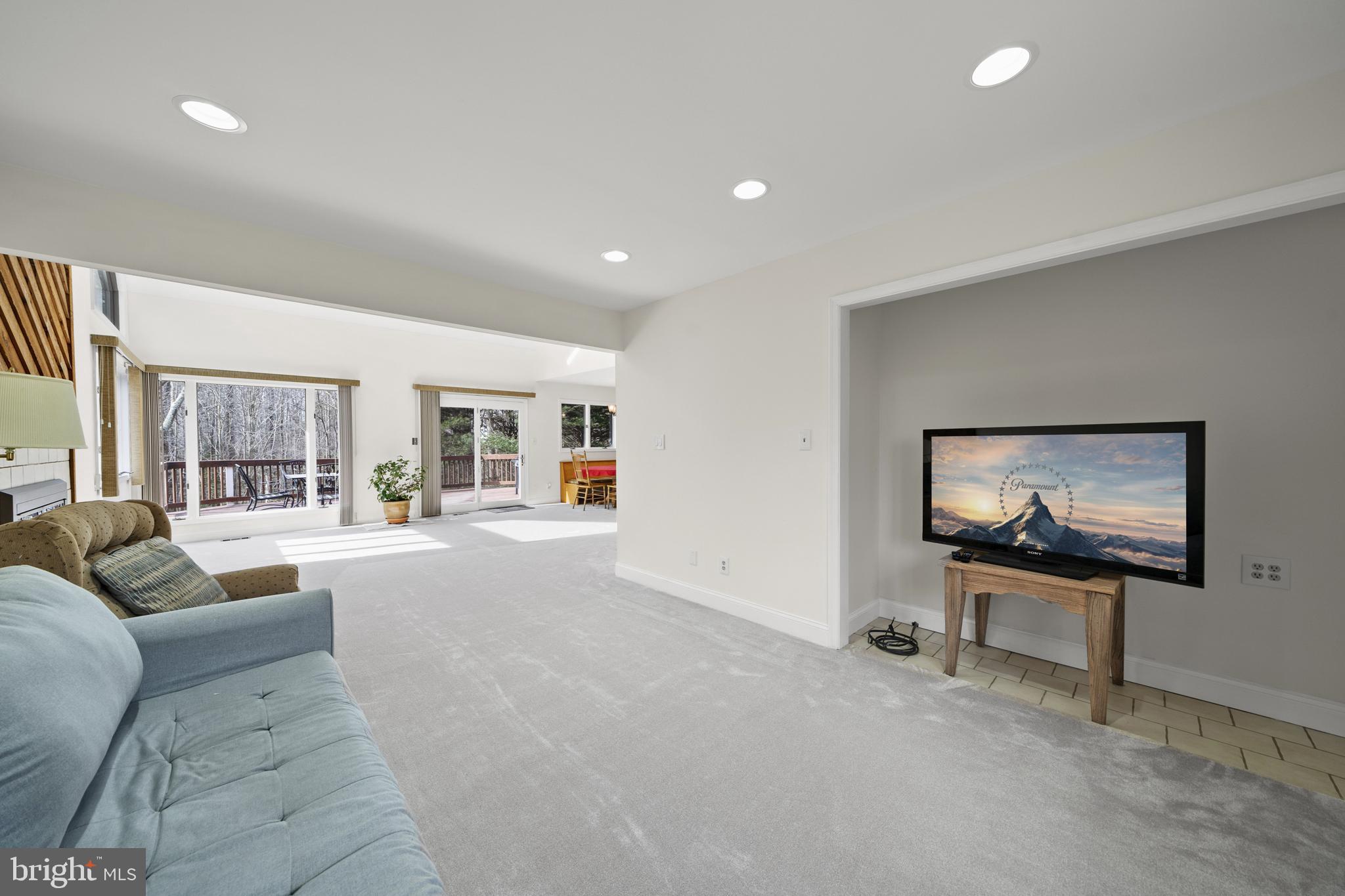 6251 Stephen Reid Road Huntingtown, MD 20639 - Photo 17 of 46 a living room with furniture and a flat screen tv