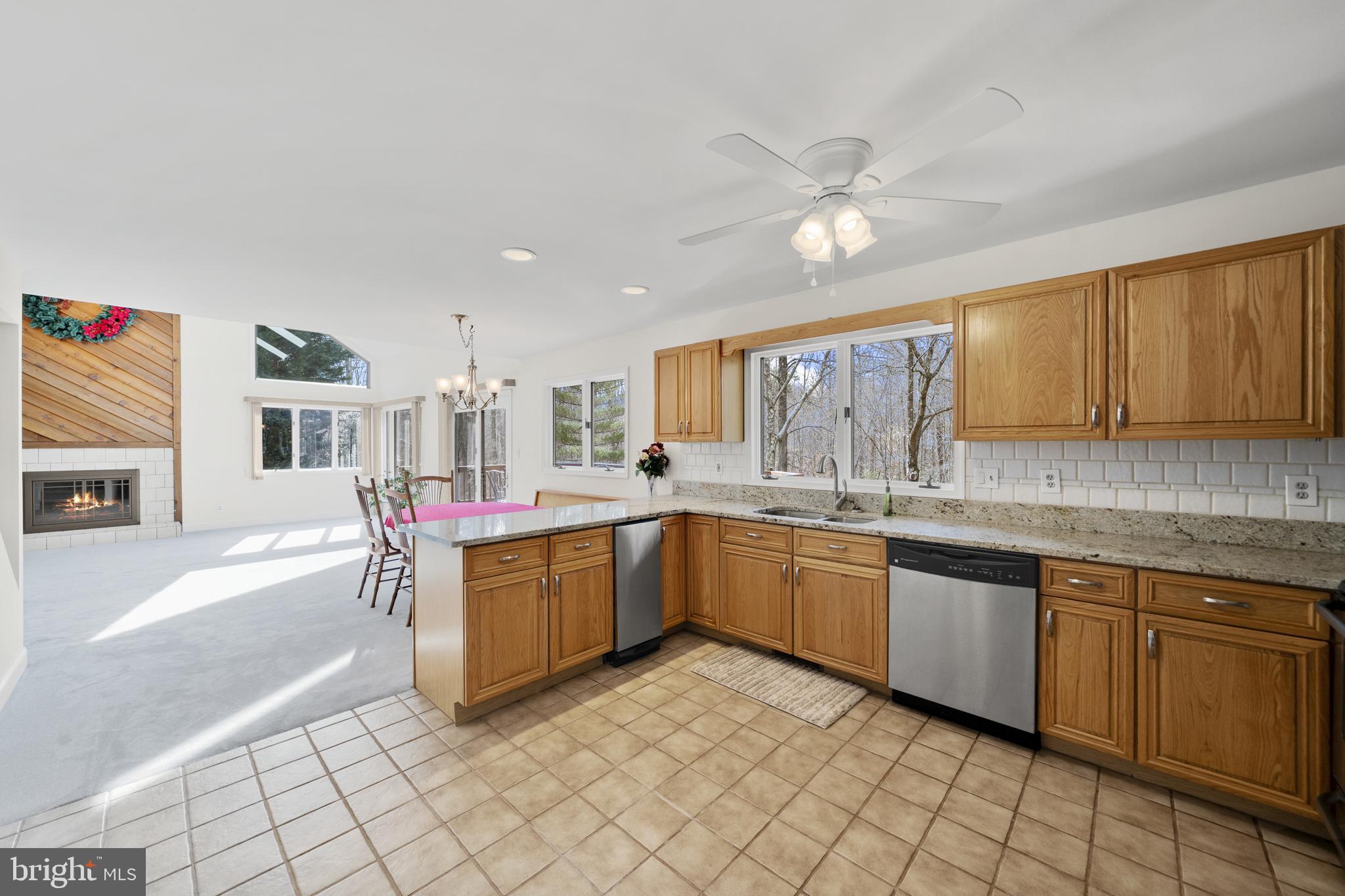 6251 Stephen Reid Road Huntingtown, MD 20639 - Photo 20 of 46 a kitchen with a sink cabinets and window