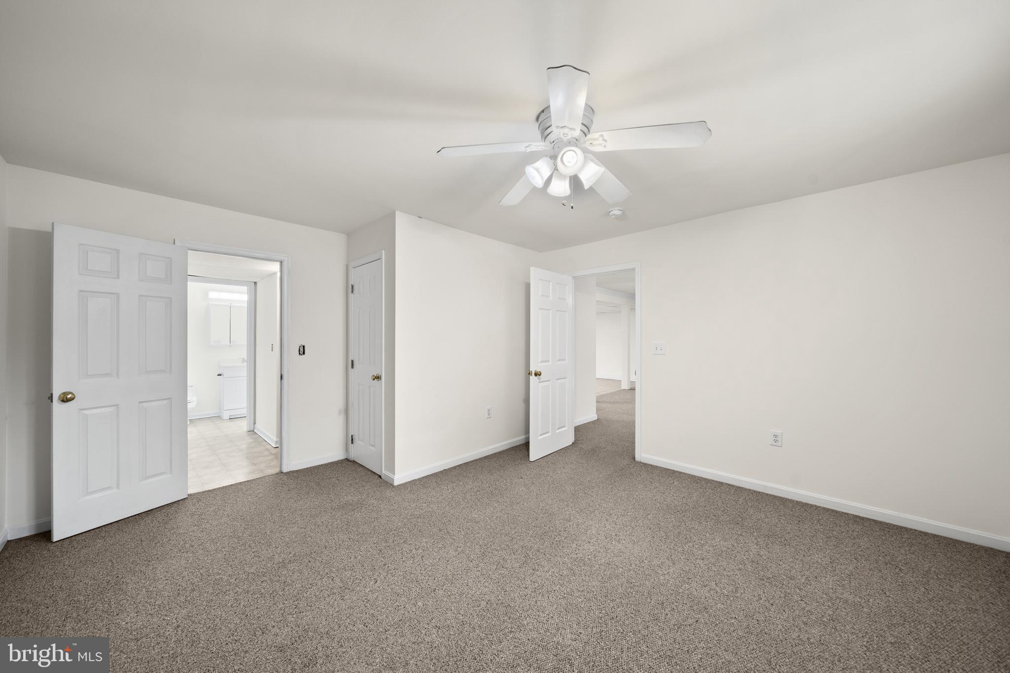 6251 Stephen Reid Road Huntingtown, MD 20639 - Photo 31 of 46 an empty room with a view of a livingroom