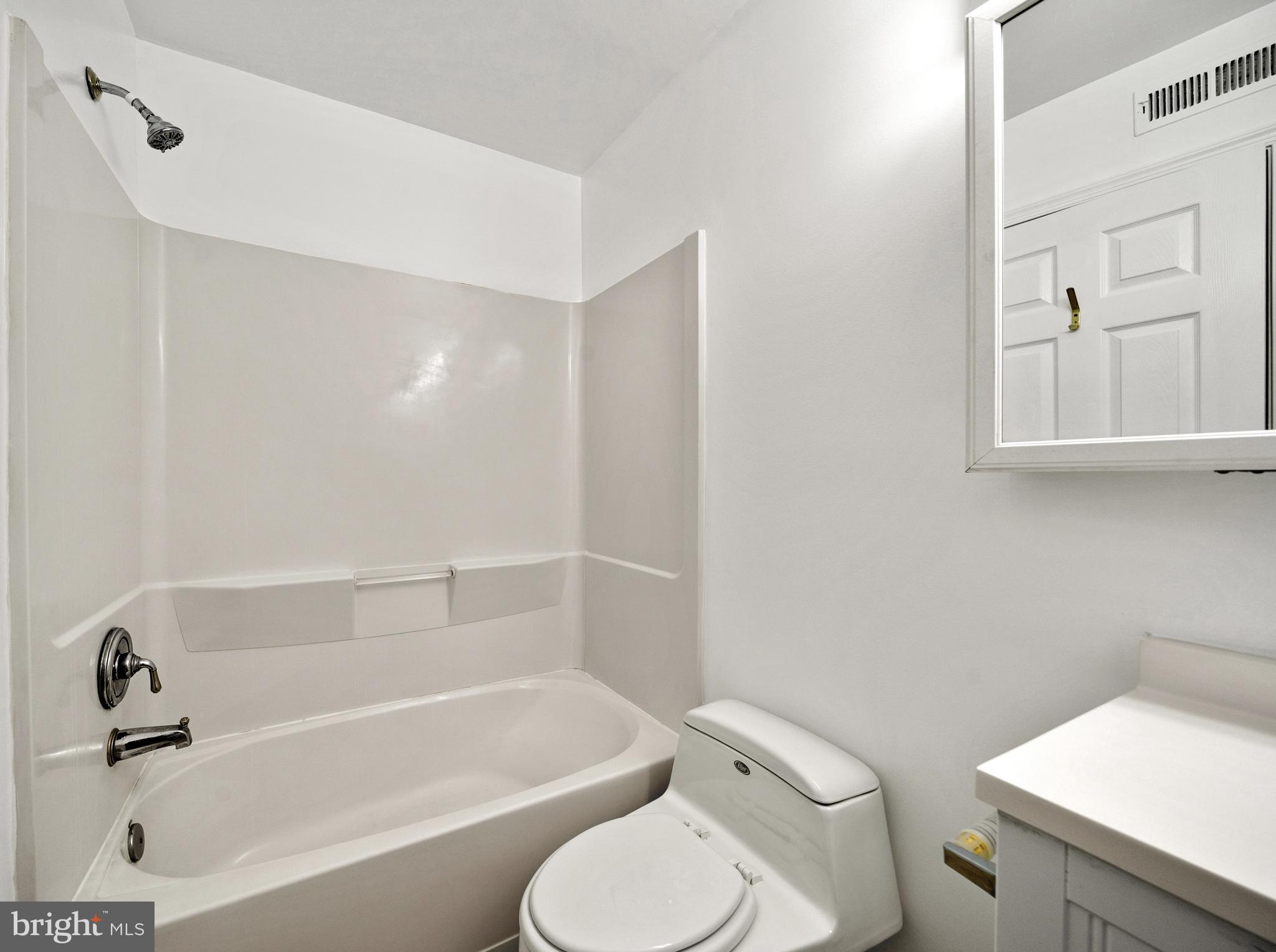 6251 Stephen Reid Road Huntingtown, MD 20639 - Photo 34 of 46 a bathroom with a toilet and a bathtub