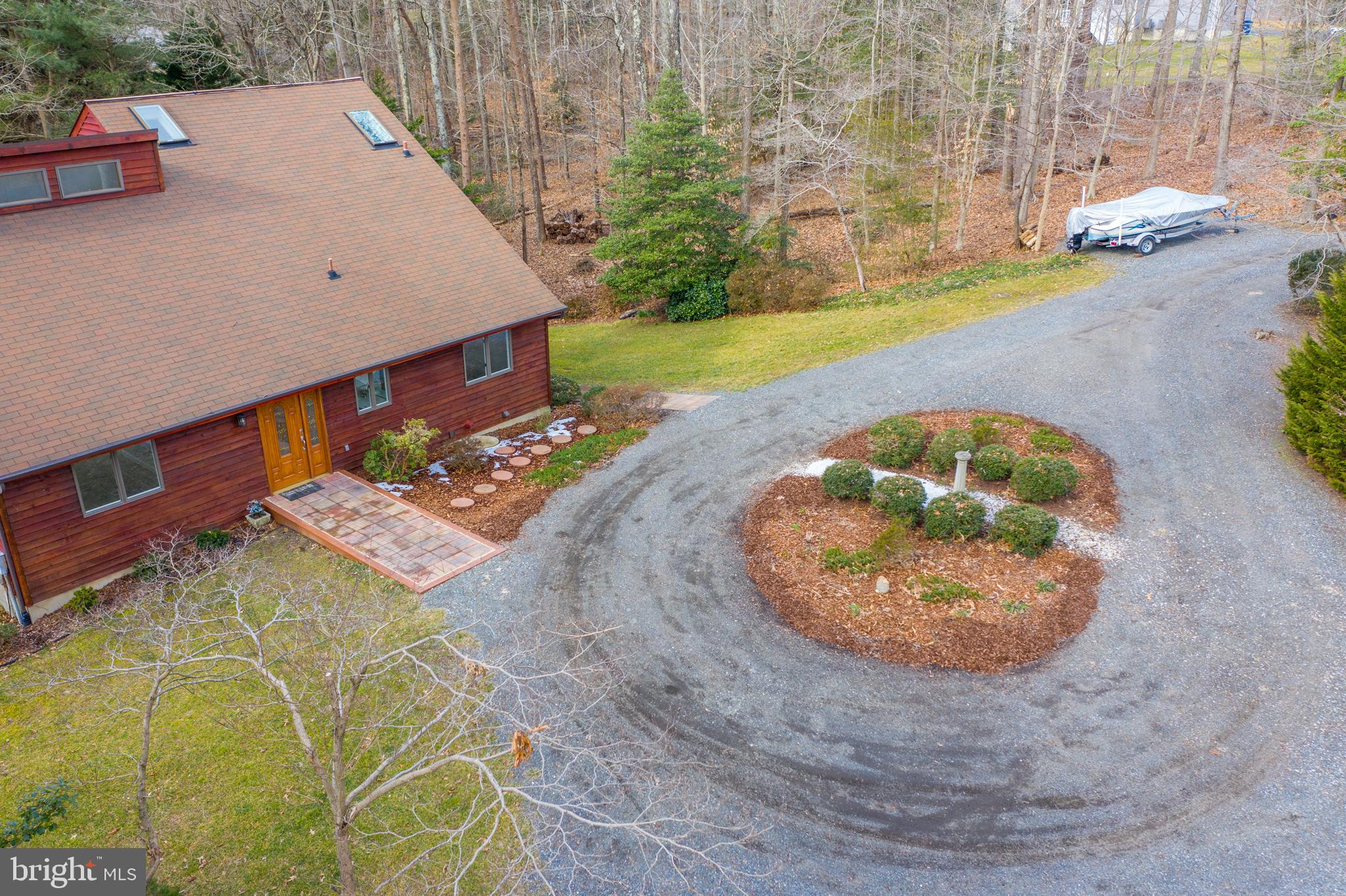 6251 Stephen Reid Road Huntingtown, MD 20639 - Photo 38 of 46 an aerial view of a house with a yard
