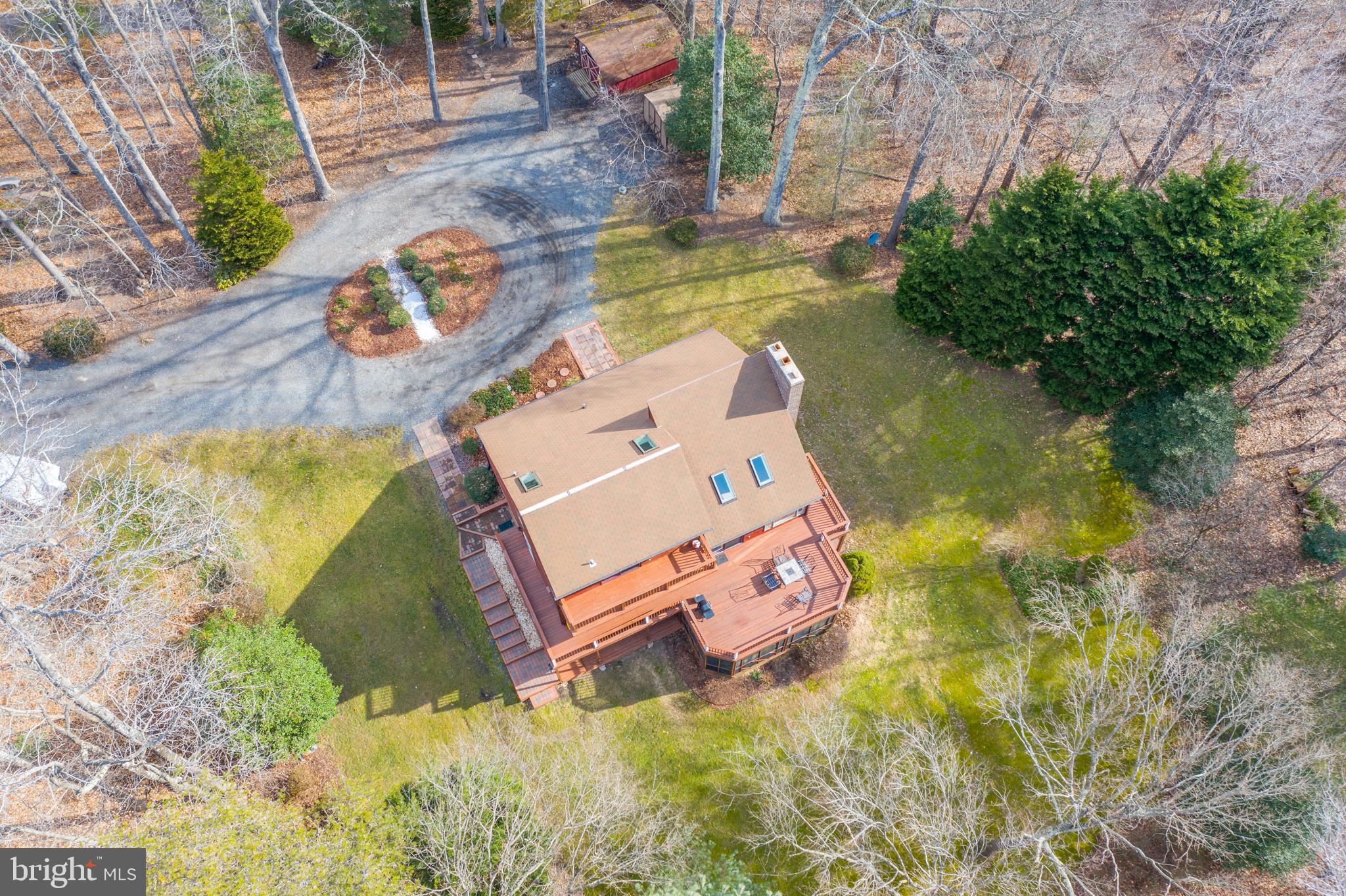 6251 Stephen Reid Road Huntingtown, MD 20639 - Photo 40 of 46 an aerial view of a house with swimming pool