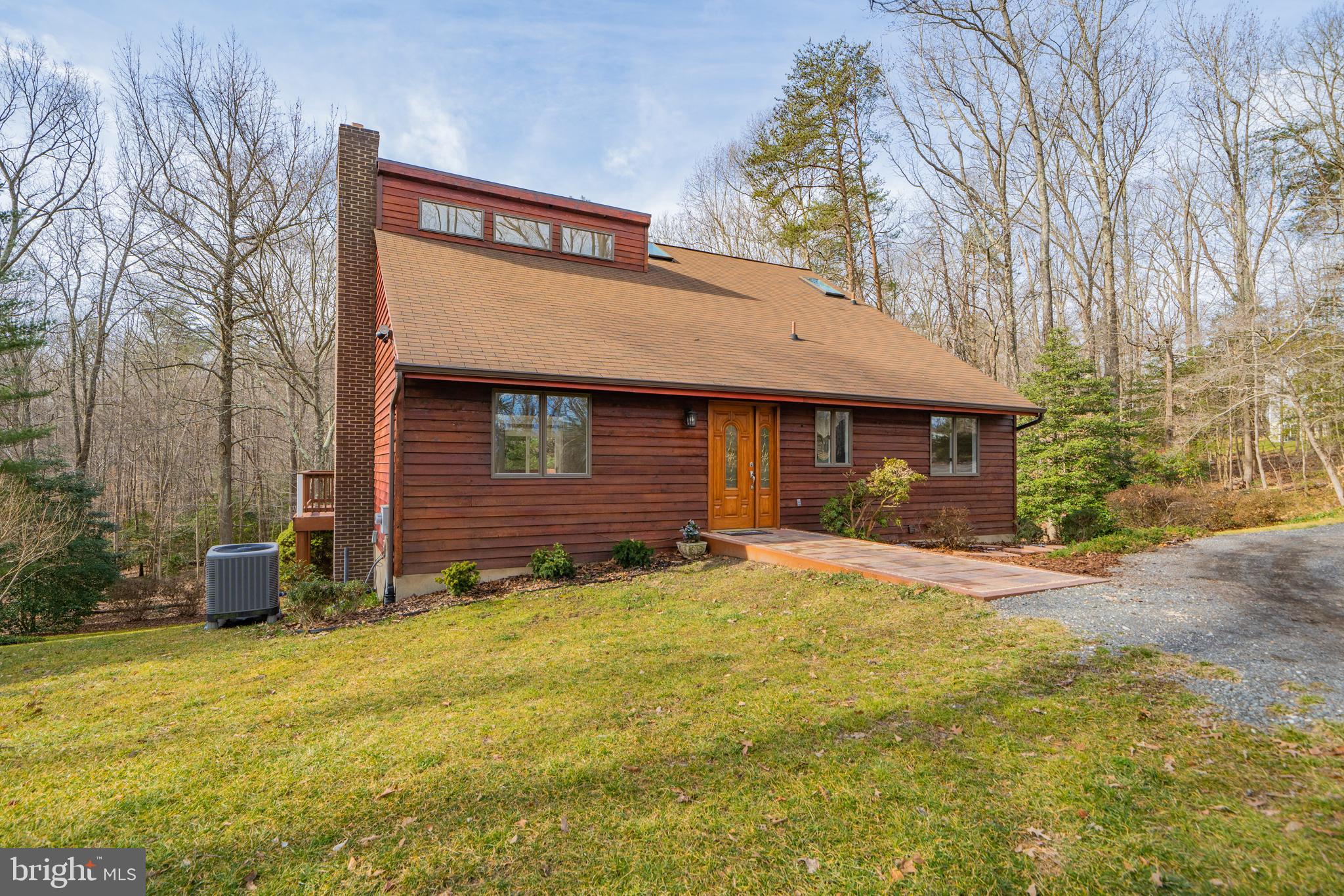 6251 Stephen Reid Road Huntingtown, MD 20639 - Photo 5 of 46 a view of a house with backyard and garden