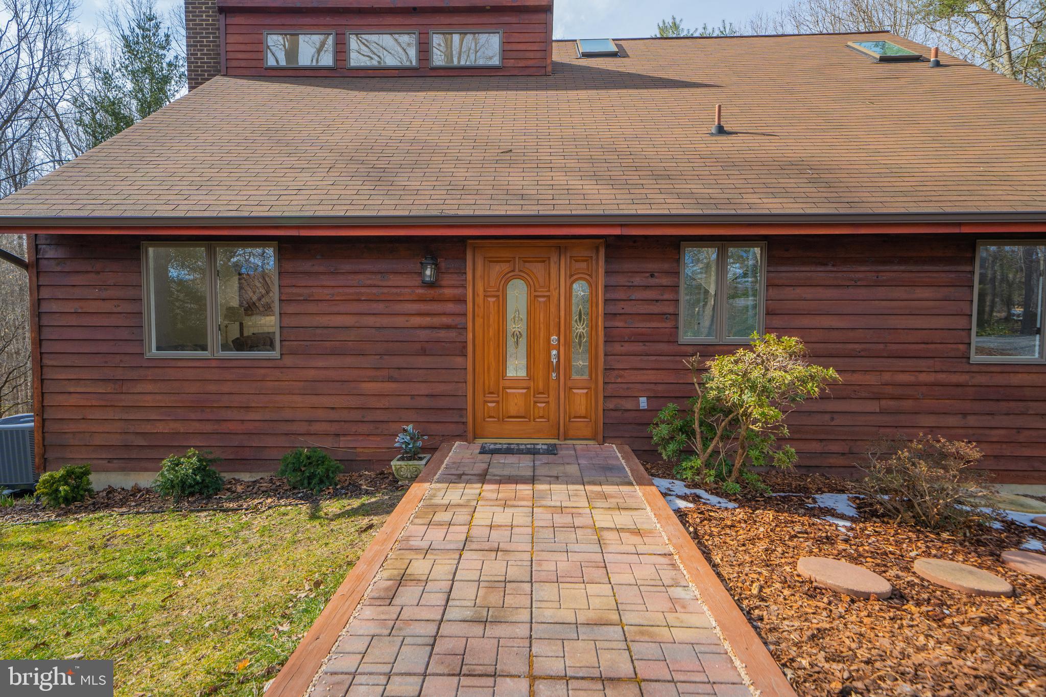6251 Stephen Reid Road Huntingtown, MD 20639 - Photo 46 of 46 a front view of a house with garden