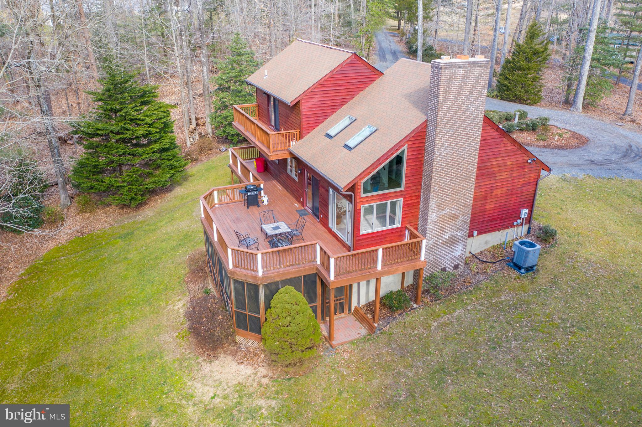 6251 Stephen Reid Road Huntingtown, MD 20639 - Photo 7 of 46 an aerial view of a house with swimming pool and porch