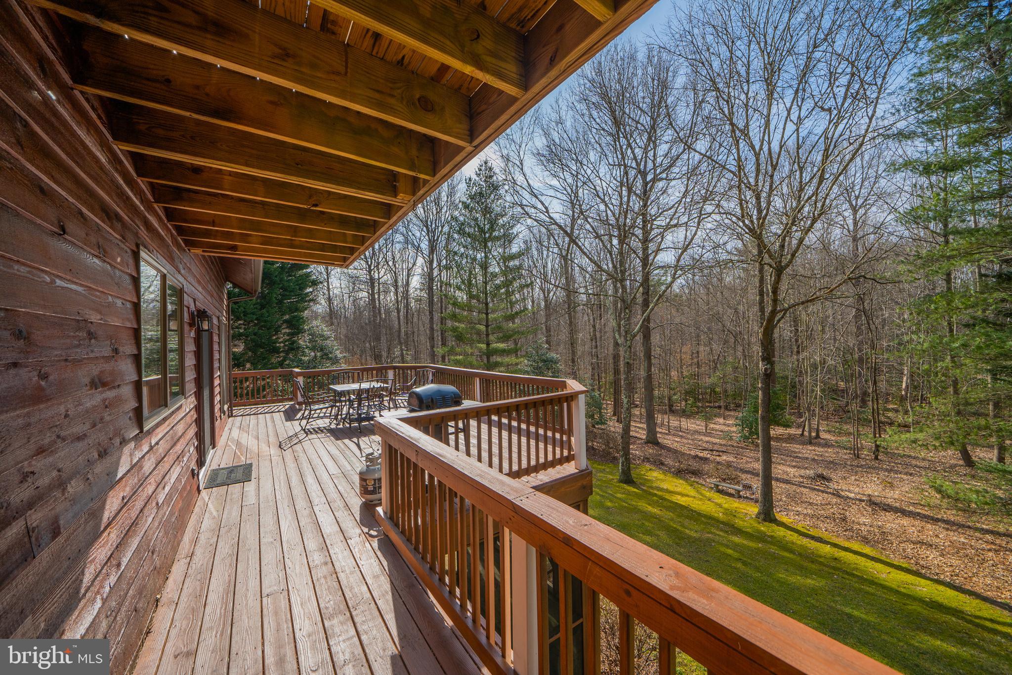 6251 Stephen Reid Road Huntingtown, MD 20639 - Photo 10 of 46 a view of balcony with wooden floor and fence