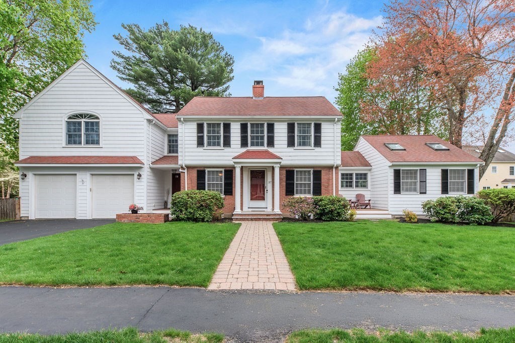 57 Douglas Road Needham, MA 02492 - Photo 1 of 22 a front view of a house with a yard