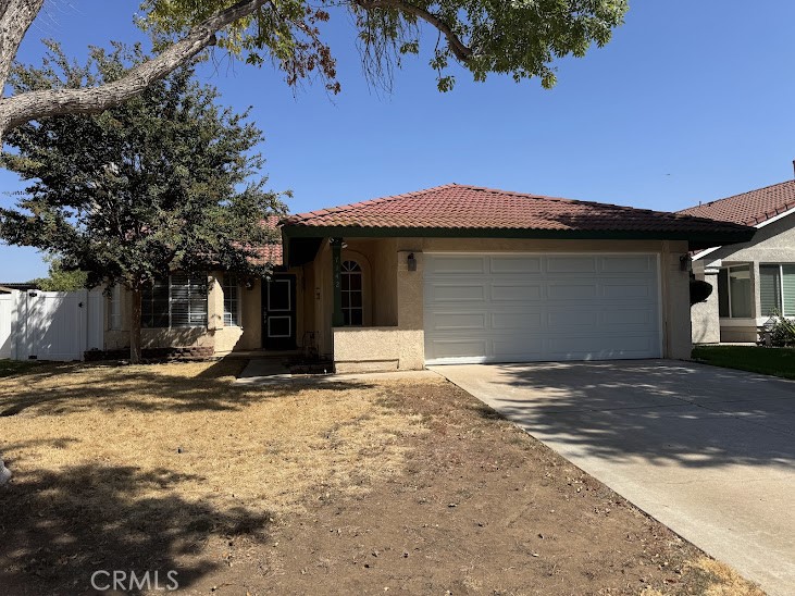7142 Rutland Avenue Riverside, CA 92503 - Photo 1 of 1 a front view of a house with a yard and garage