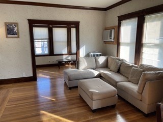 123 St Andrew Road, Unit 2 Boston, MA 02128 - Photo 1 of 8 a living room with furniture and a window