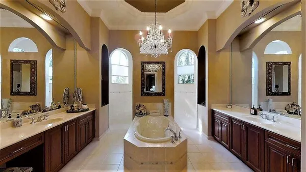 a bathroom with a double vanity sink and a large mirror