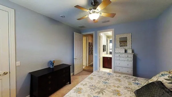 a bedroom with a bed and a dresser