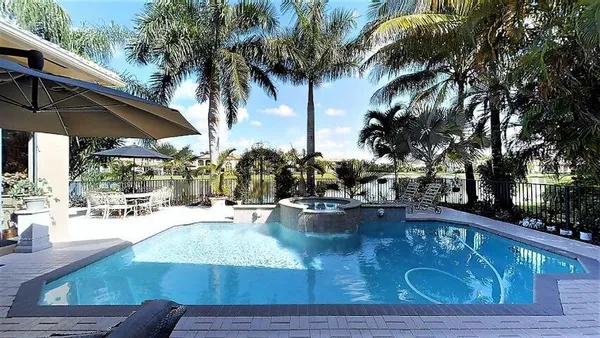 a view of a swimming pool with a patio