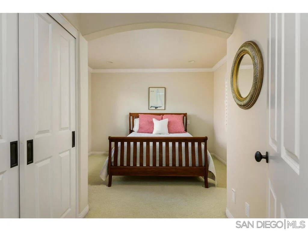 4 The Point Coronado, CA 92118 - Photo 36 of 50 a bedroom with a bed and utility room