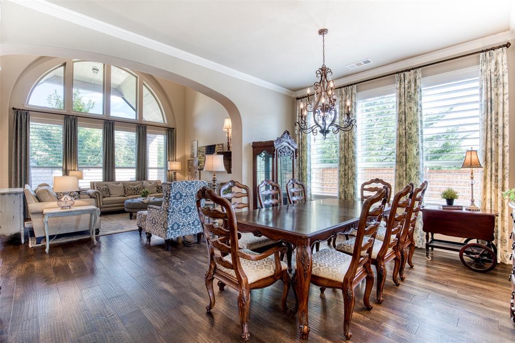7760 Hackamore Street Frisco, TX 75036 - Photo 5 of 40 Spacious dining room that opens to the living room & kitchen for entertaining in style.