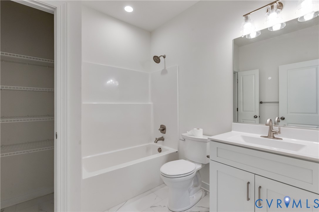 1393 Broad St Road Oilville, VA 23129 - Photo 16 of 39 Full bathroom featuring shower combination, vanit