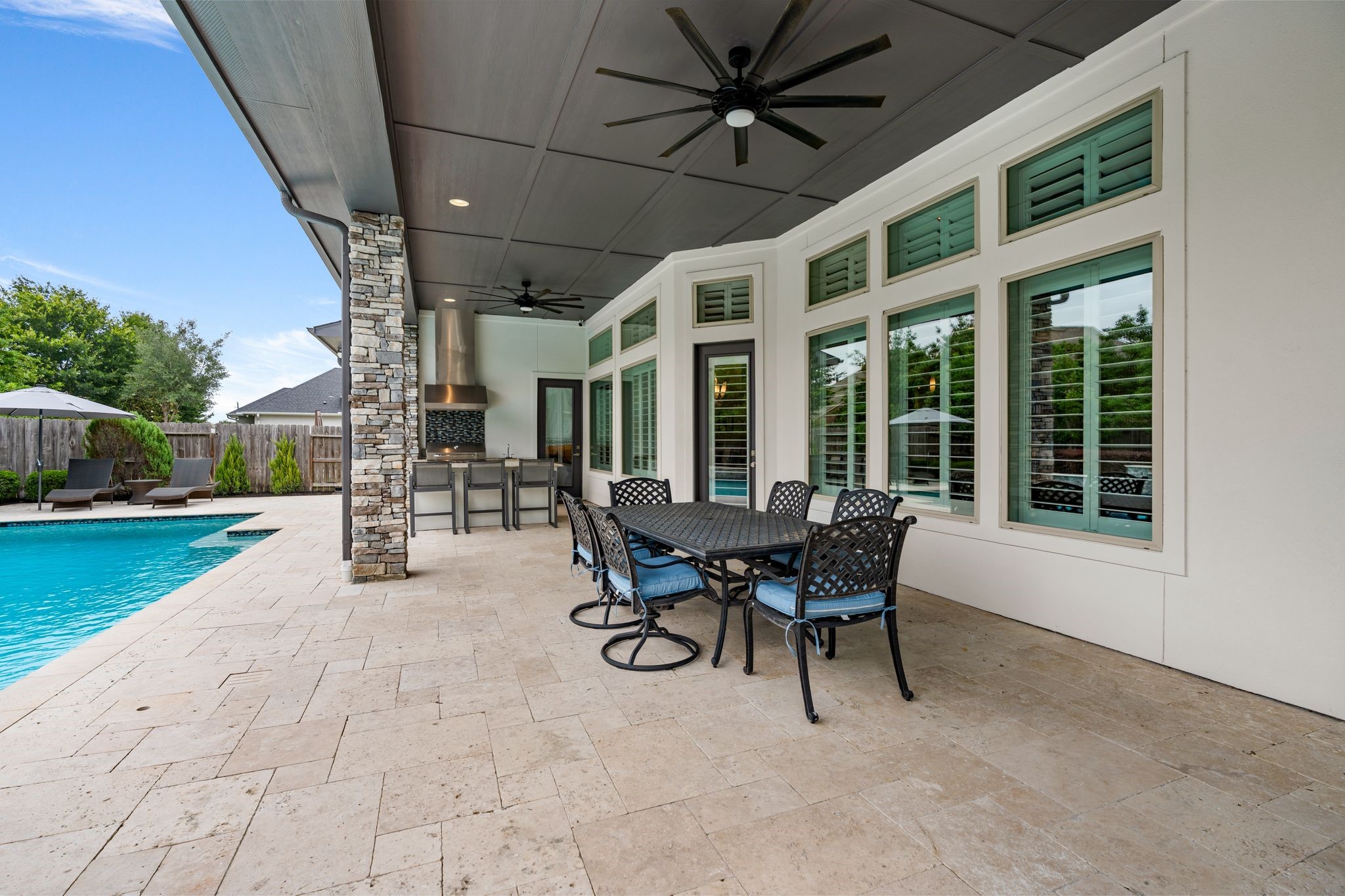 2926 Fairmont Ridge Lane Katy, TX 77494 - Photo 48 of 49 a view of a patio with table and chairs and a barbeque