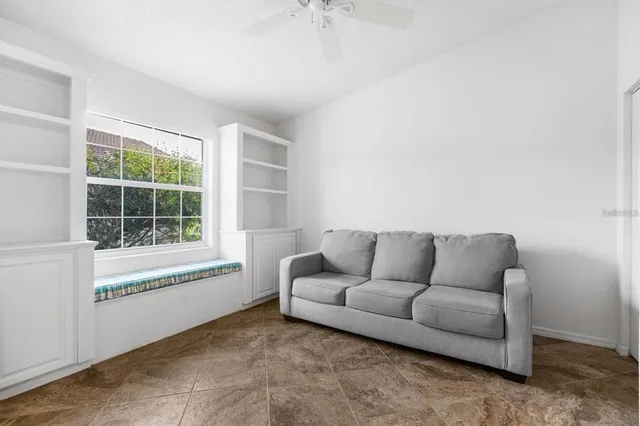 a living room with furniture and a window