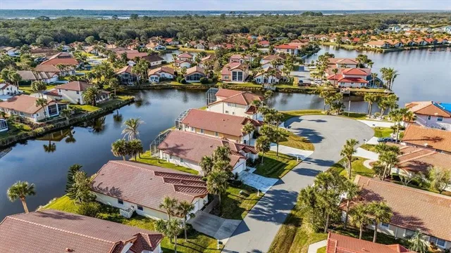 an aerial view of residential houses with outdoor space