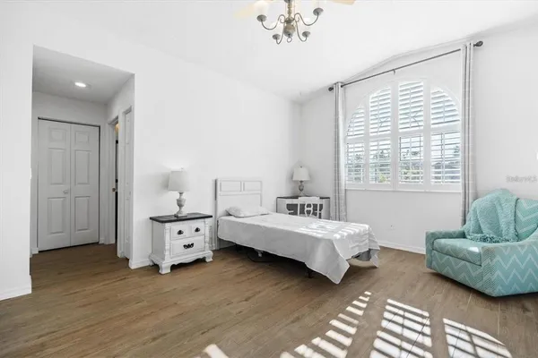 a bedroom with furniture and window