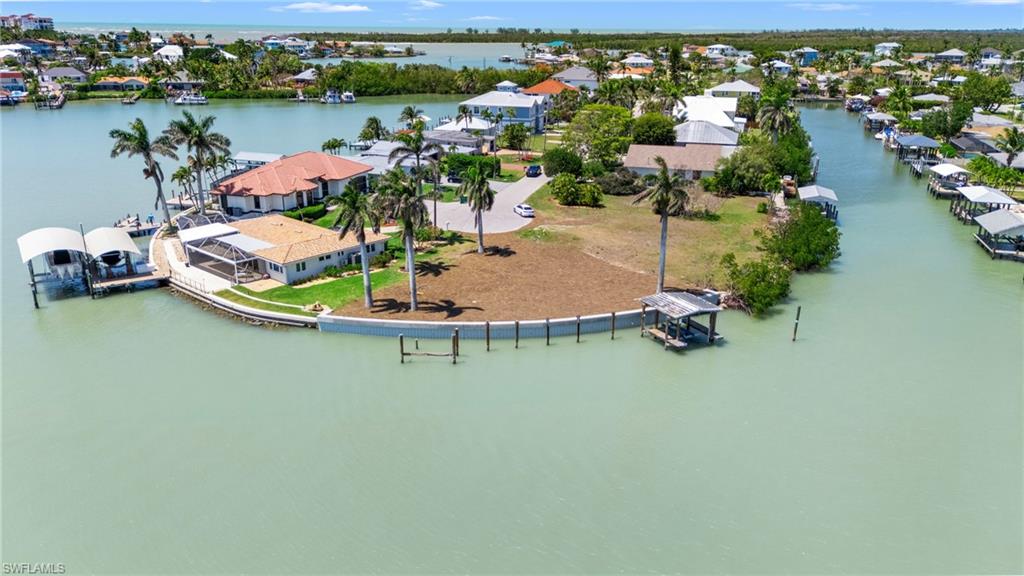 159 Tahiti Street Naples, FL 34113 - Photo 11 of 15 Birds eye view of property featuring a water view and a residential view