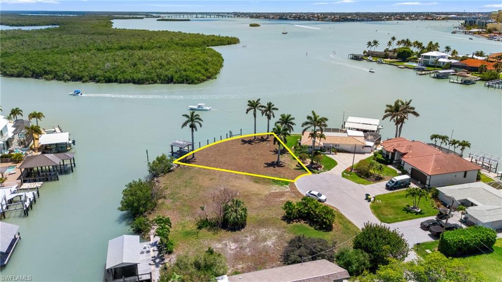 159 Tahiti Street Naples, FL 34113 - Photo 6 of 15 Birds eye view of property featuring a water view