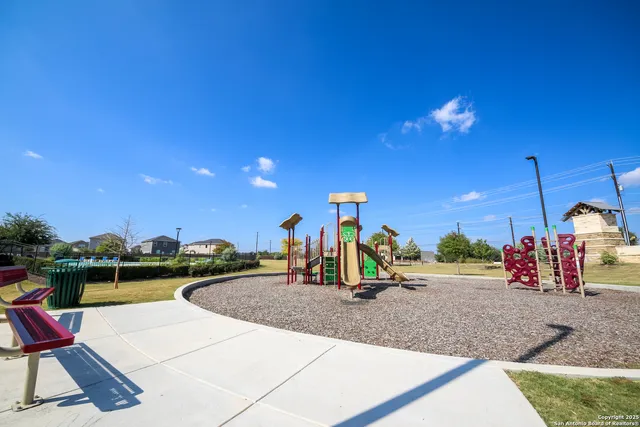 a view of a park with swings