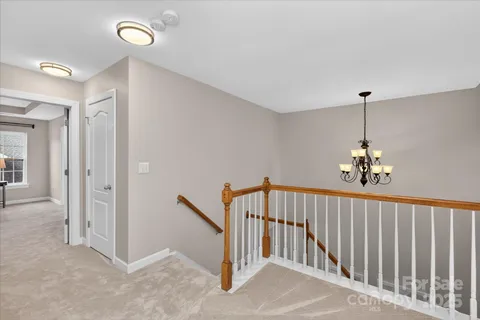 a view of a hallway view with staircase