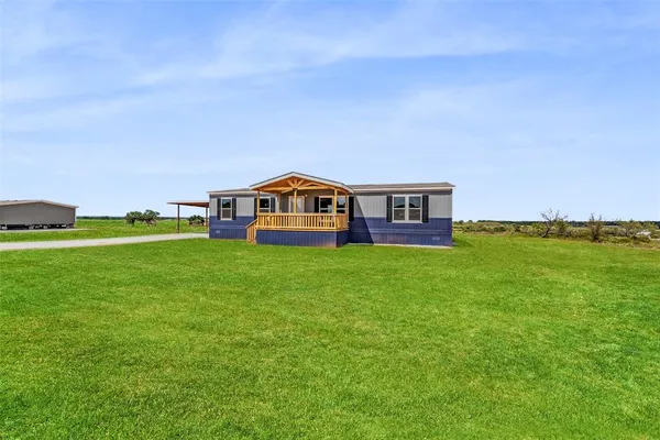 a view of a house with a big yard