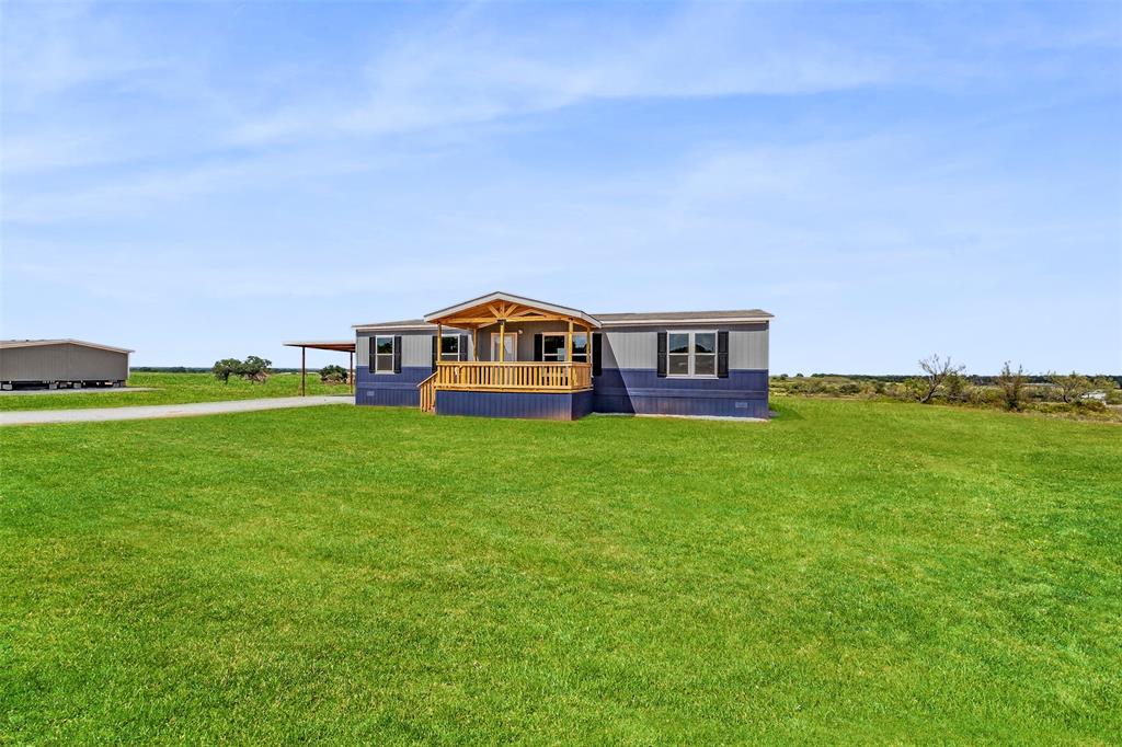 a view of a house with a big yard